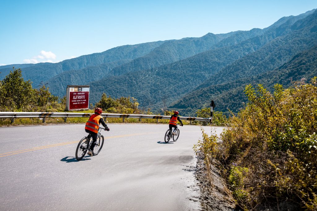 Tourists biking along the Inca Jungle trail