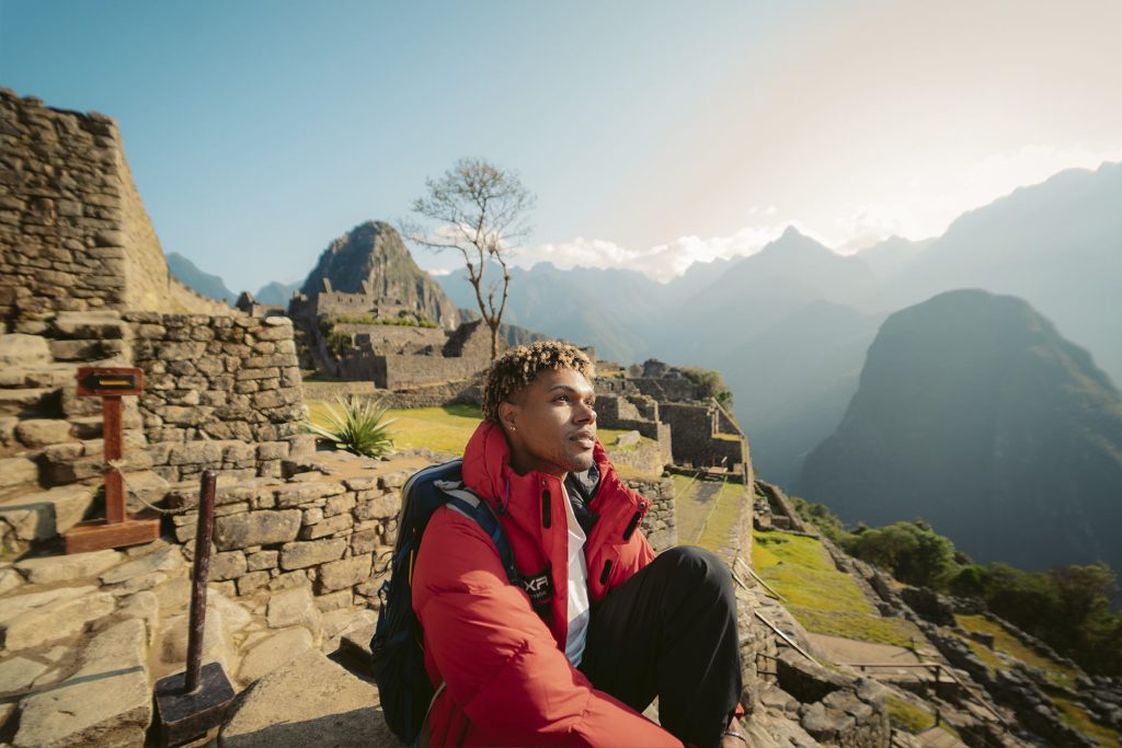 Visitor looking out over Machu Picchu