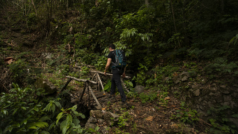 Tourist enjoying the scenery on the Inca jungle trail to Machu Picchu