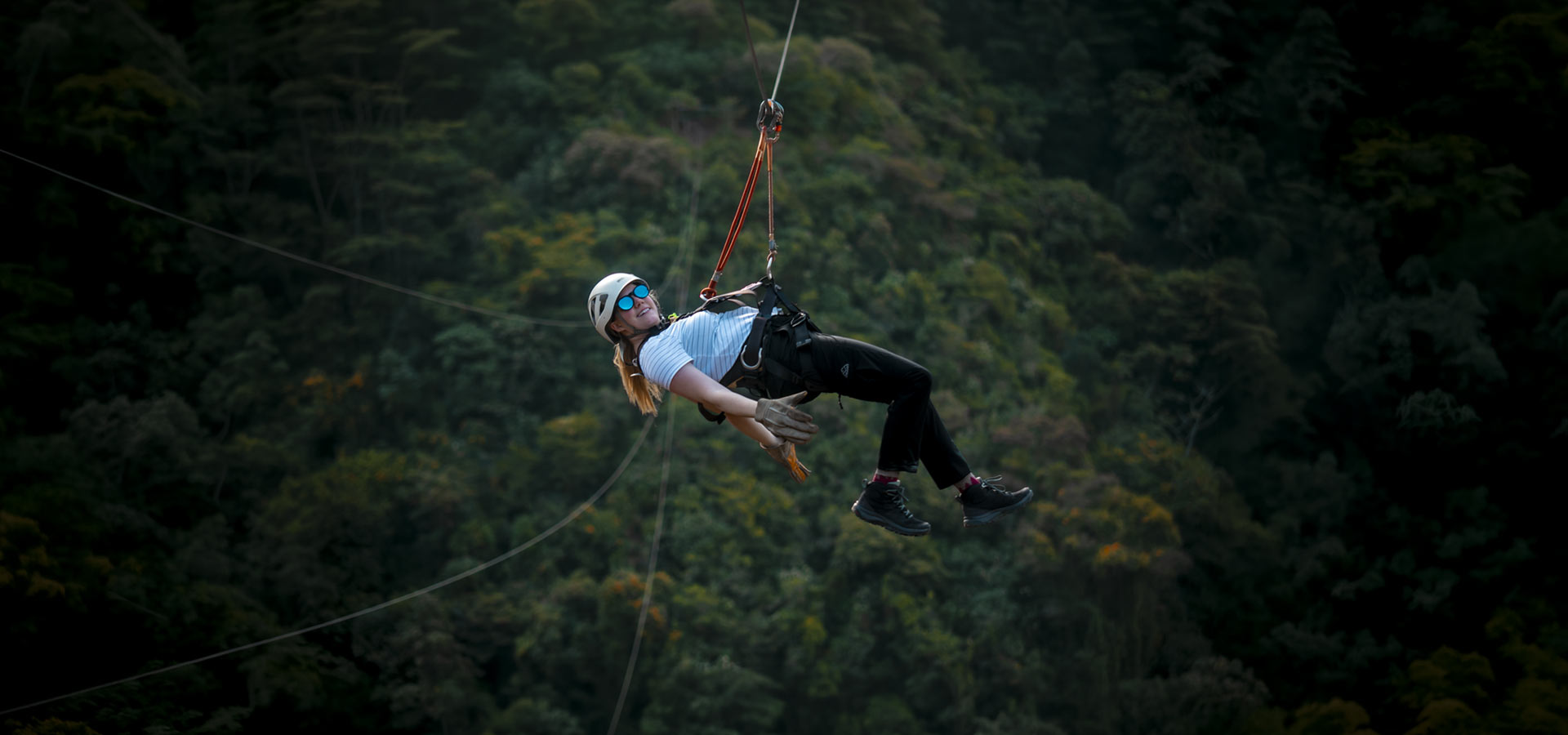Happy tourist ziplining on the Inca Jungle route to Machu Picchu